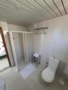 a bathroom with a toilet and a shower at CLEOPATRA AQUA HOTEL in Alanya