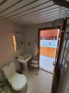 a bathroom with a toilet and a sink at CLEOPATRA AQUA HOTEL in Alanya