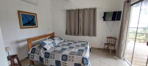Uma cama ou camas num quarto em Villa Girassol