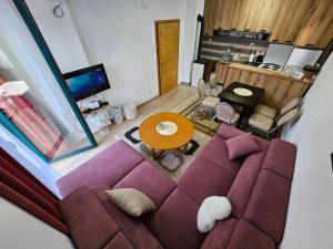 an overhead view of a living room with a purple couch at Ruža vetrova in Kušići