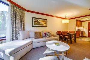 a living room with a couch and a table at Breathtaking Olympic Valley Gem Walk to Chairlift in Olympic Valley