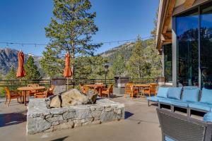a patio with a fire pit and tables and chairs at Breathtaking Olympic Valley Gem Walk to Chairlift in Olympic Valley