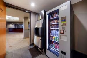 a refrigerator filled with lots of drinks in a hallway at Best Western Lanai Garden Inn & Suites in San Jose