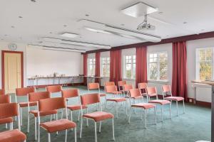 a room with a bunch of chairs in it at Best Western Solhem Hotel in Visby