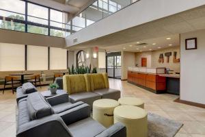 a lobby with couches and tables and a kitchen at Drury Inn & Suites Atlanta Marietta in Marietta