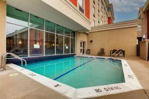 a swimming pool in the courtyard of a building at Drury Inn & Suites St. Louis Arnold in Arnold