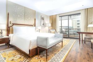 Ένα ή περισσότερα κρεβάτια σε δωμάτιο στο Radisson Collection Hotel & Spa, Riverfront Srinagar