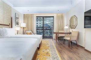 Ένα ή περισσότερα κρεβάτια σε δωμάτιο στο Radisson Collection Hotel & Spa, Riverfront Srinagar