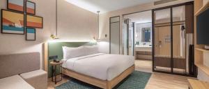 Postel nebo postele na pokoji v ubytování Hilton Garden Inn Tbilisi Riverview
