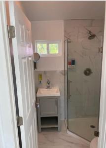 a bathroom with a shower and a sink at Room with private bath Santoniri inspired in Seattle +6 photos