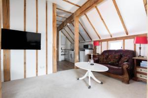 a living room with a couch and a table at Maldon Executive Apartments in Maldon