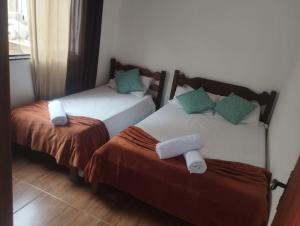 Ένα ή περισσότερα κρεβάτια σε δωμάτιο στο Casa do Aconchego