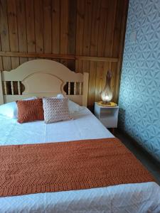 Ένα ή περισσότερα κρεβάτια σε δωμάτιο στο Cabanas MORIÁ