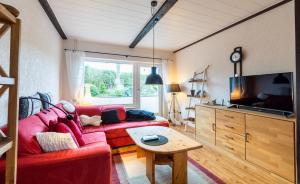 TV a/nebo společenská místnost v ubytování Uwe's Huus