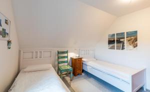 Postel nebo postele na pokoji v ubytování Uwe's Huus