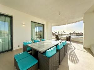 a dining room with a table and chairs at Brand New 3BR Ground Floor Pool Walkout at Las Palomas in Puerto Peñasco