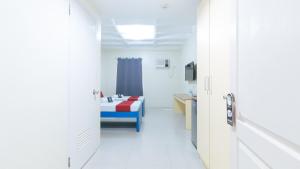 Letto o letti in una camera di RedDoorz @ Insular Square Mandaue City