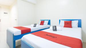 Letto o letti in una camera di RedDoorz @ Insular Square Mandaue City