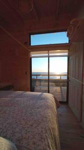 Fotografie z fotogalerie ubytování Cabaña Orca Lodge Sur frente al mar en Curanipe, Desconéctate para reconectar v destinaci Curanipe + 3 fotografie