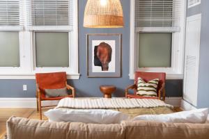 a living room with two chairs and a couch at Sleepover No 103 in Philadelphia