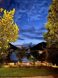 a view of a lake at night at Nhà trên cây in Hanoi