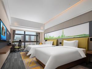 Een TV en/of entertainmentcenter bij Hampton by Hilton Shenzhen Baoan Stadium
