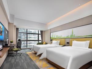 Een TV en/of entertainmentcenter bij Hampton by Hilton Shenzhen Baoan Stadium
