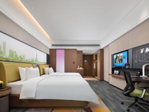 Een TV en/of entertainmentcenter bij Hampton by Hilton Shenzhen Baoan Stadium
