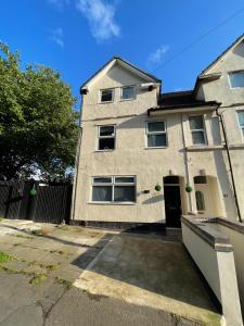 an empty parking lot in front of a house at 5- Large 1 bed Apartment- West Midlands 