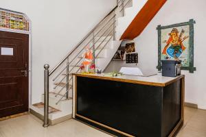 a desk in a room with a staircase at SPOT ON Hotel All Orchha View in Orchha
