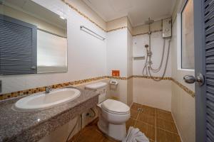 a bathroom with a toilet and a sink and a shower at FunDee Boutique Hotel in Patong Beach +40 photos