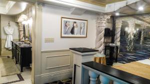 a dressing room with a mannequin in the corner of the room at The Anniversary Inn - South Temple in Salt Lake City