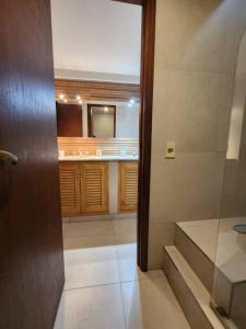 a bathroom with a sink and a mirror at Viajar y sentirse en casa! in Mendoza