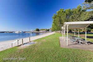 a park with benches and a pavilion next to the beach at 6A Hough Street - pet friendly, air con, wi-fi and linen provided in Nelson Bay