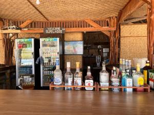 a bar with a lot of bottles of alcohol at Q'Pelagos Sunset Bungalow in Gili Trawangan