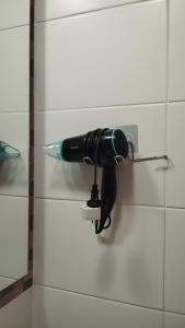 a blow dryer is attached to a wall at Mirador 2 de Playa Brava in Iquique