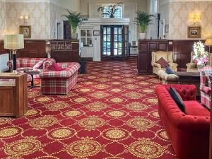 a living room with red furniture and a red carpet at Family Lodge No, 3 - Uk45692 in Moulin