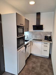 Kuchyňa alebo kuchynka v ubytovaní MB APARTMÁNY LIPNO