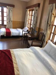 Postelja oz. postelje v sobi nastanitve Boudha Dungkar guest house