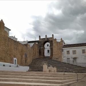 an old building with stairs in front of it at Precioso apartamento con patio interior. in Medina Sidonia