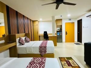 Postel nebo postele na pokoji v ubytování Cozy Hotel@ KL Sentral