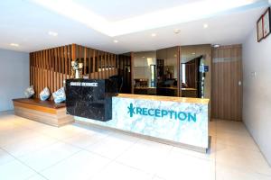 a store with a reception counter in a room at Kudo Hotel & Beach Club - Adults Only in Patong Beach