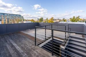 a balcony with a railing on top of a building at Central DC Home+Private Rooftop! (Unit B) in Washington
