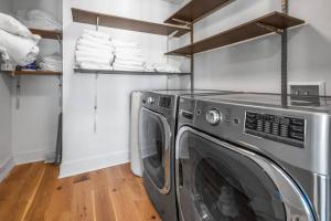 a laundry room with a washing machine and towels at Central DC Home+Private Rooftop! (Unit B) in Washington