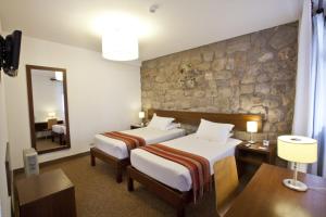 Rúm í herbergi á Tierra Viva Cusco Saphi Hotel