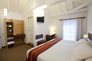 Rúm í herbergi á Tierra Viva Cusco Saphi Hotel