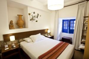 Rúm í herbergi á Tierra Viva Cusco Saphi Hotel