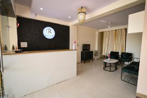 a waiting room with a counter and a table at Raj Residency in Jodhpur