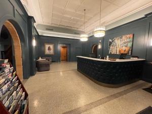 a lobby with a reception desk in a building at Kalispell Grand Hotel in Kalispell