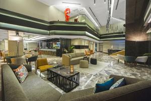a lobby of a hotel with couches and chairs at Arts Hotel Harbiye - Special Class in Istanbul